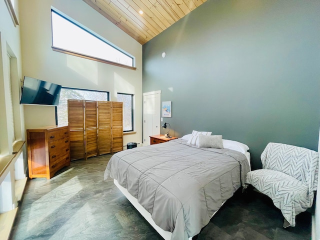 bedroom with high vaulted ceiling and wooden ceiling