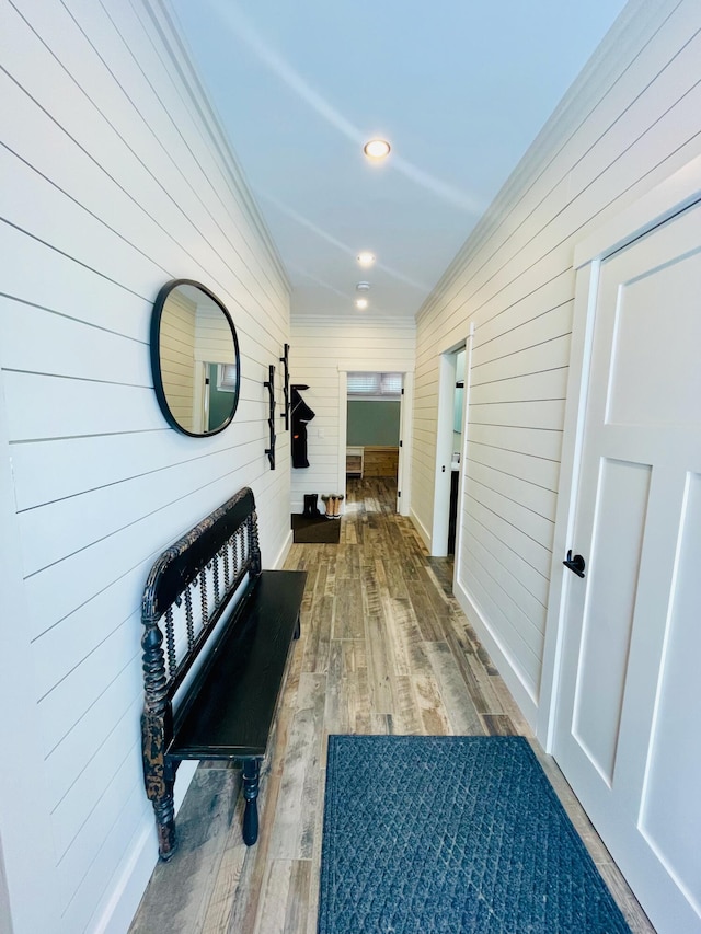 hall featuring crown molding and wood-type flooring