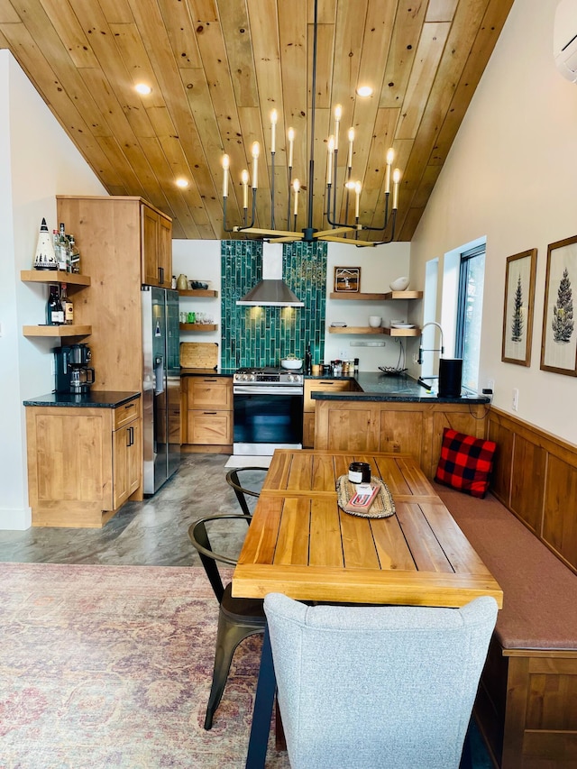 kitchen with wood ceiling, stainless steel appliances, kitchen peninsula, and wall chimney exhaust hood