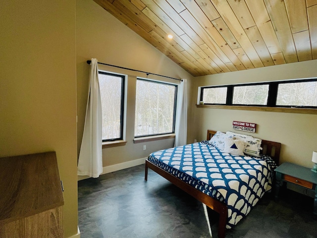 bedroom featuring vaulted ceiling and wood ceiling