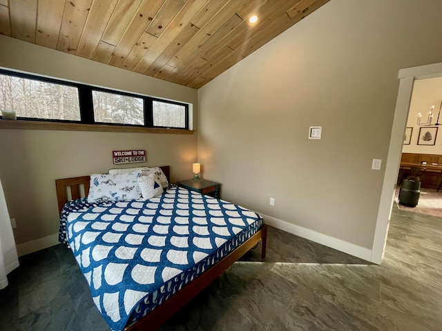 bedroom with wood ceiling and vaulted ceiling