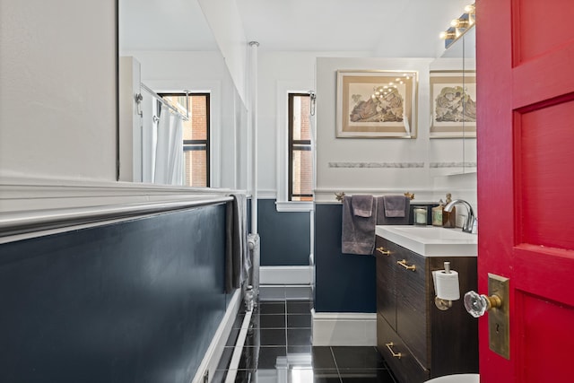 bathroom featuring tile patterned flooring and vanity