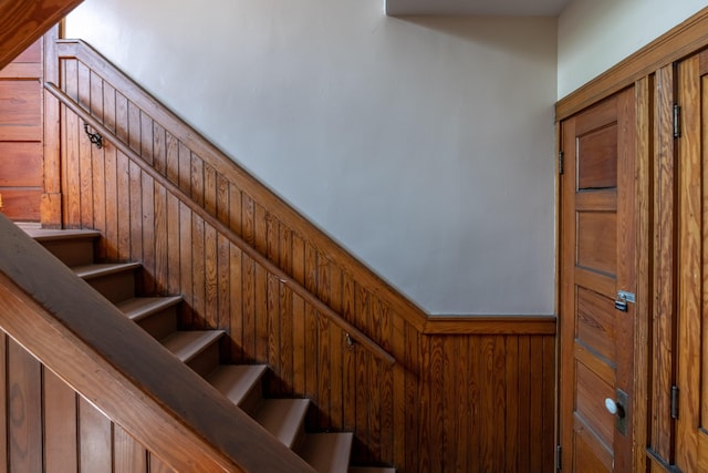 stairway with wooden walls