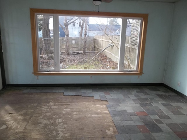 interior space with plenty of natural light and ceiling fan