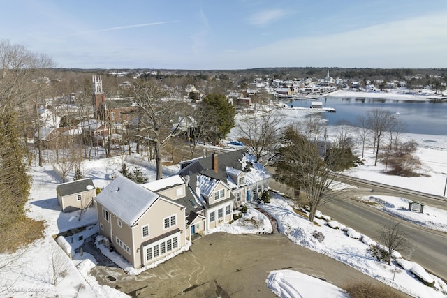 snowy aerial view featuring a residential view