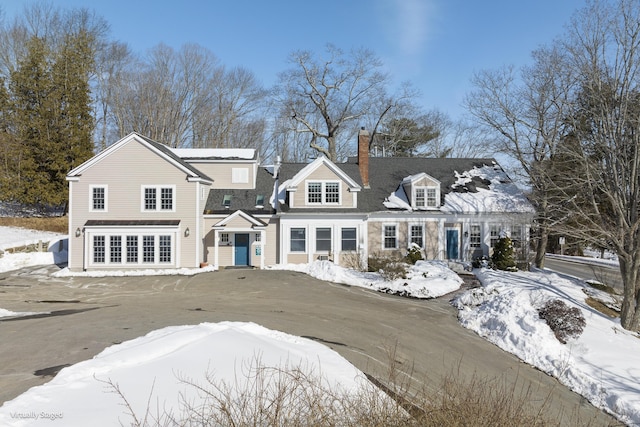 view of front of home with a chimney