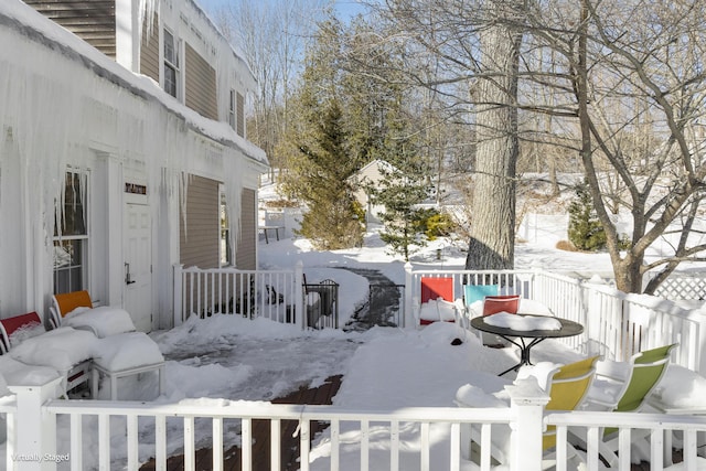 view of snow covered deck