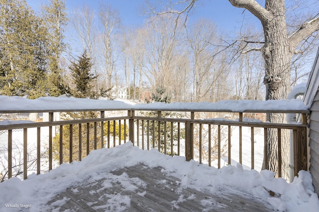 view of snow covered deck