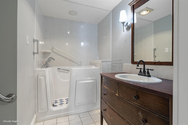 bathroom with tile patterned flooring and vanity