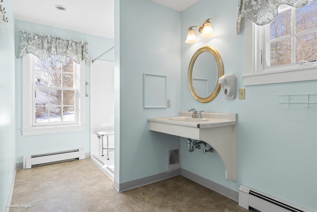 full bathroom featuring a baseboard radiator, a sink, visible vents, and baseboards