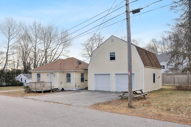 view of front of house featuring a deck and a garage