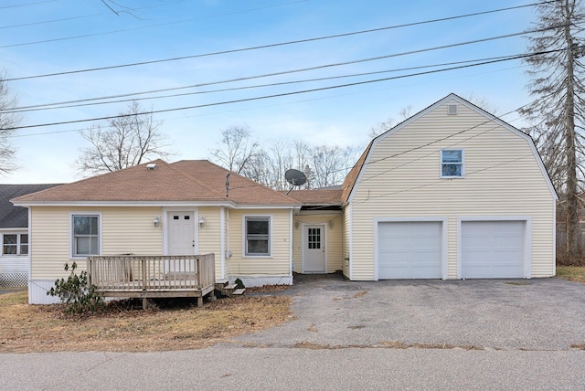 view of front of house featuring a deck and a garage