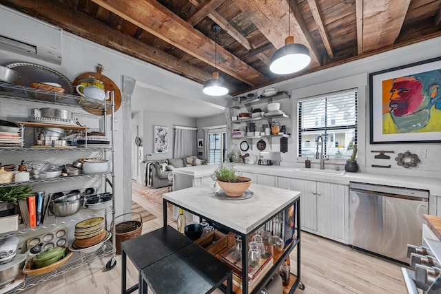 kitchen with beam ceiling, dishwasher, sink, white cabinets, and wood ceiling