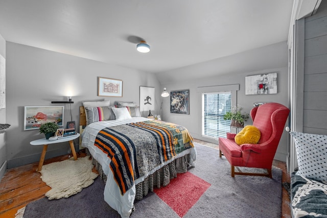 bedroom with lofted ceiling