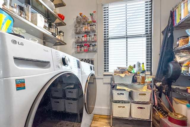 clothes washing area featuring washing machine and dryer