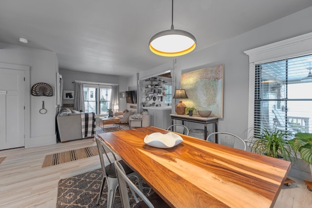 dining space featuring light hardwood / wood-style flooring