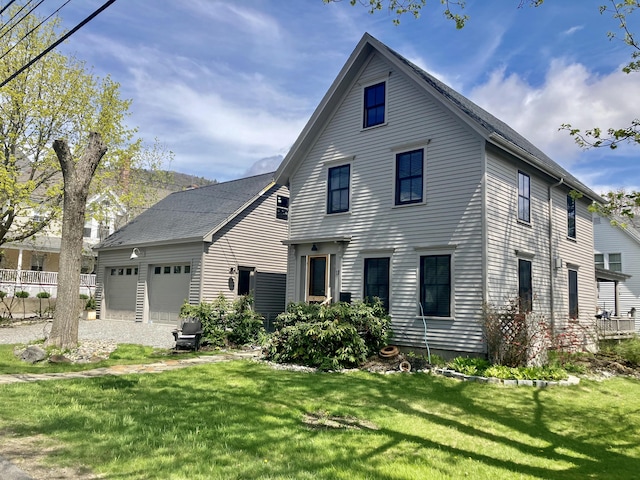 17 Mountain St, Camden, ME 04843 - view of front of property with a front yard and a garage