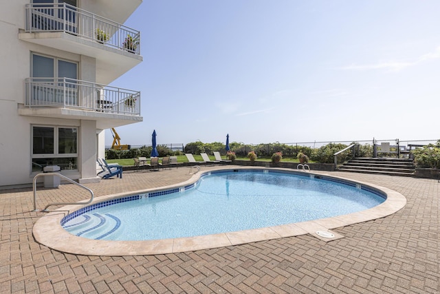 view of pool featuring a patio area