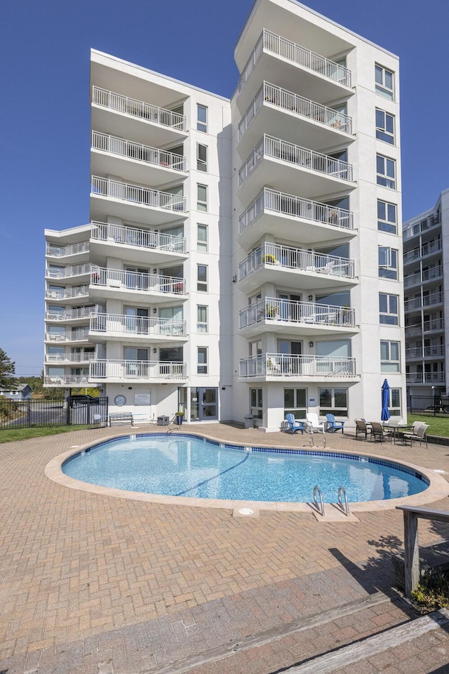 view of swimming pool with a patio