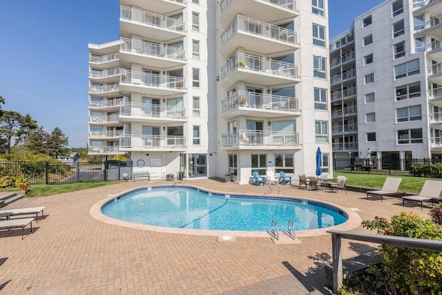 view of swimming pool with a patio