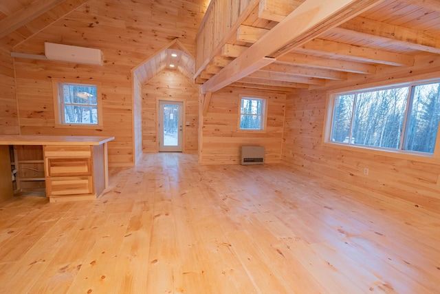 additional living space featuring wood walls, wood ceiling, light wood-style floors, and beamed ceiling