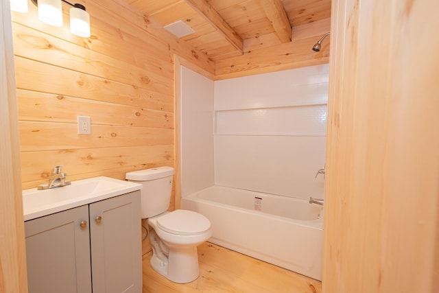 bathroom with wooden walls, toilet, wooden ceiling, tub / shower combination, and vanity