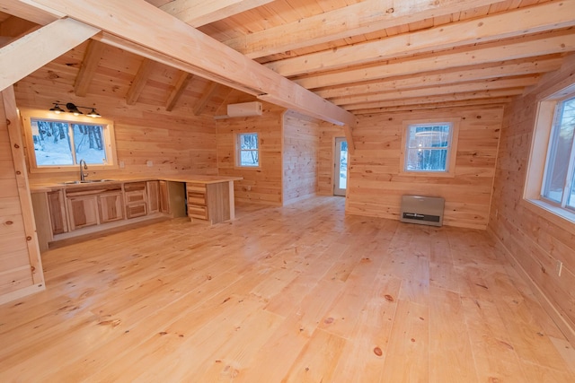 bonus room featuring wooden walls, wooden ceiling, light wood-style flooring, a sink, and beam ceiling