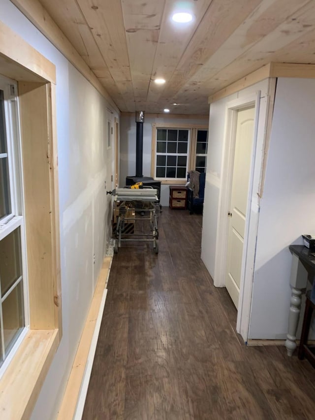 corridor featuring wooden ceiling and dark wood-type flooring