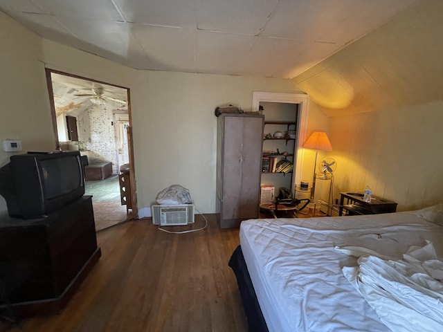 bedroom featuring dark hardwood / wood-style flooring and vaulted ceiling