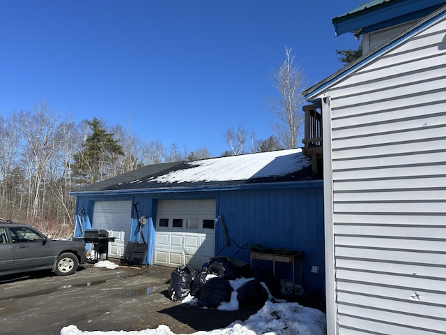 view of snow covered garage