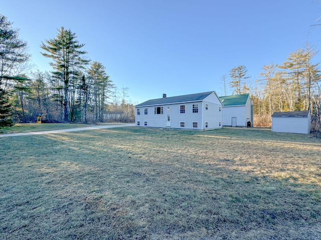 exterior space with a yard and a storage unit