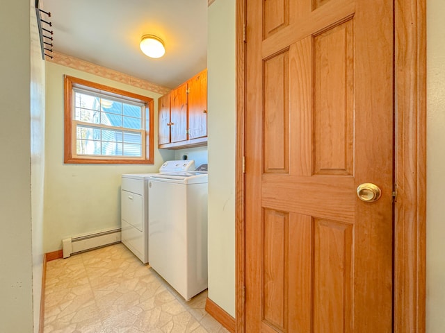 laundry area with cabinets, separate washer and dryer, and a baseboard heating unit