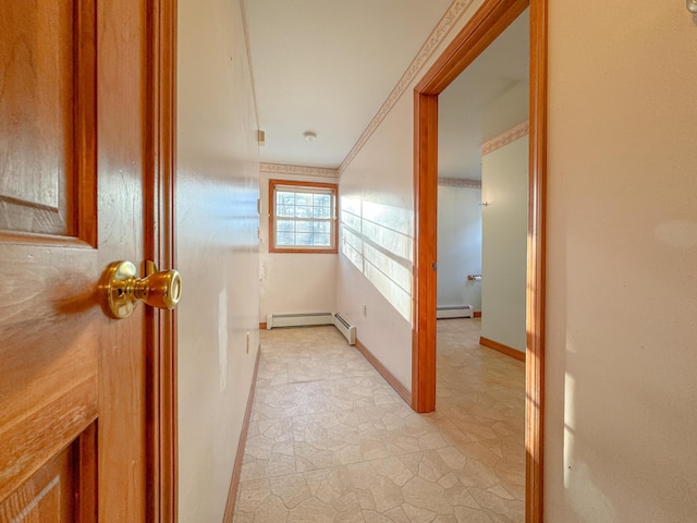 hallway featuring ornamental molding and a baseboard heating unit