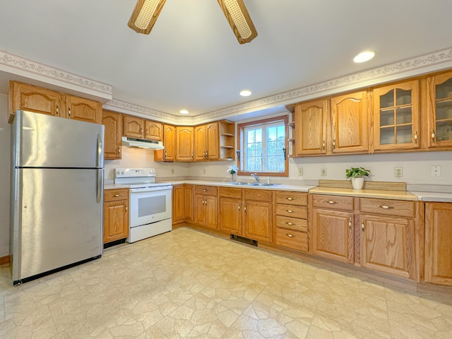 kitchen featuring stainless steel fridge, white range with electric stovetop, ceiling fan, and sink