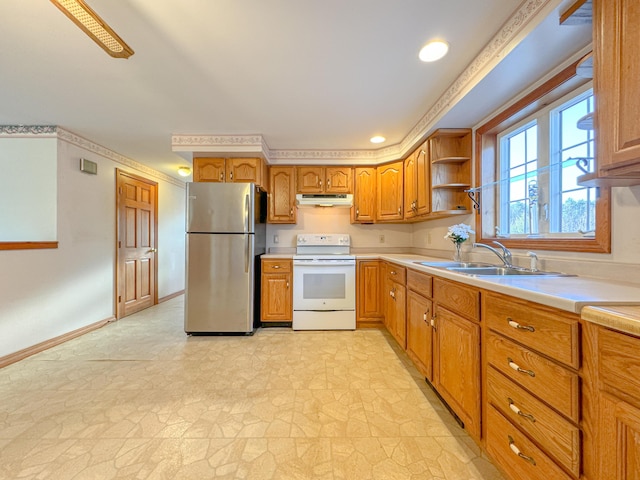 kitchen with white range with electric cooktop, ceiling fan, stainless steel refrigerator, and sink