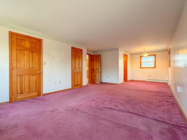 unfurnished room with a baseboard heating unit, carpet floors, and crown molding