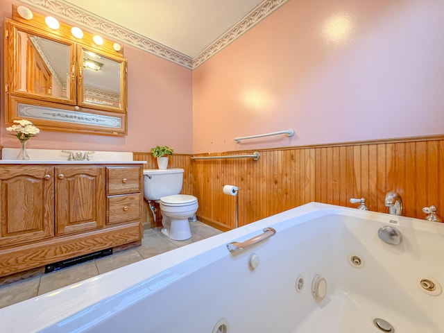 bathroom featuring wood walls, a bathing tub, sink, tile patterned flooring, and toilet