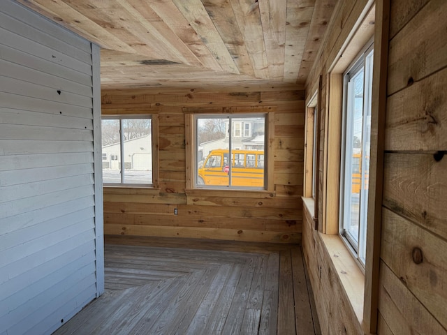 unfurnished sunroom featuring wood ceiling