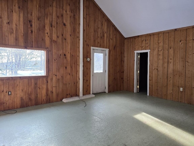 spare room featuring vaulted ceiling