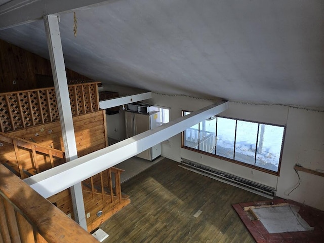 interior space with hardwood / wood-style floors, baseboard heating, and vaulted ceiling