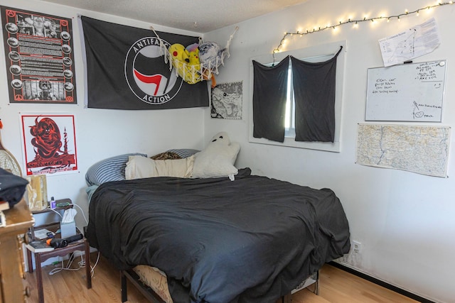 bedroom featuring wood-type flooring