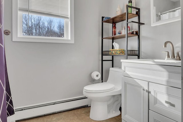 bathroom with toilet, tile patterned flooring, a baseboard radiator, and vanity