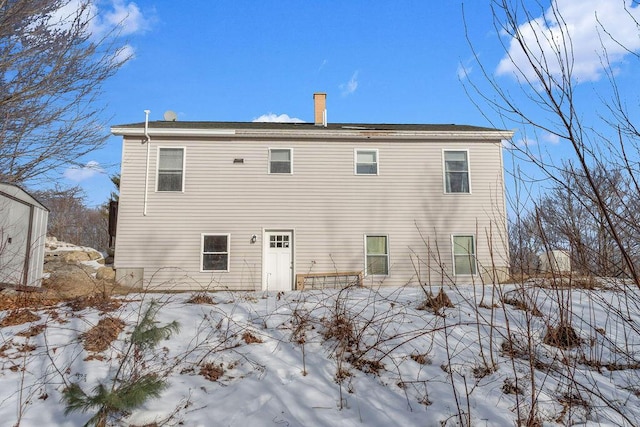 view of snow covered house