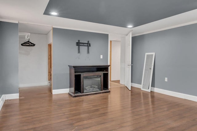 unfurnished living room with hardwood / wood-style flooring