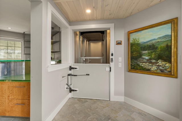 doorway with wood ceiling