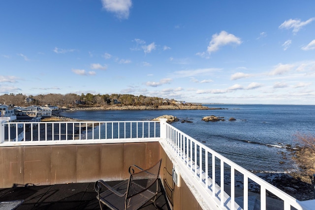 balcony featuring a water view