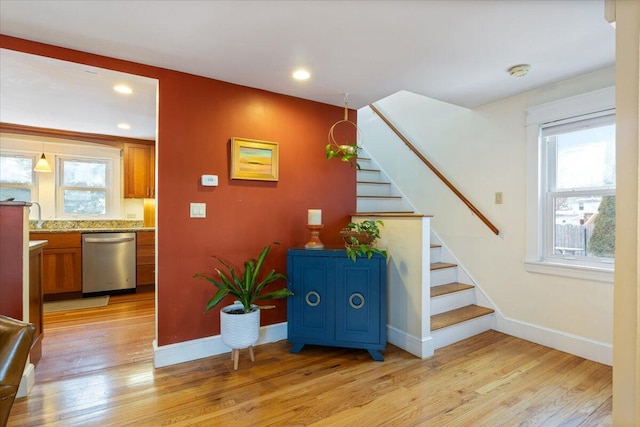 stairway with hardwood / wood-style flooring