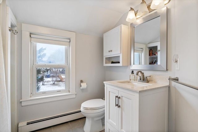 bathroom featuring lofted ceiling, toilet, a baseboard heating unit, tile patterned floors, and vanity