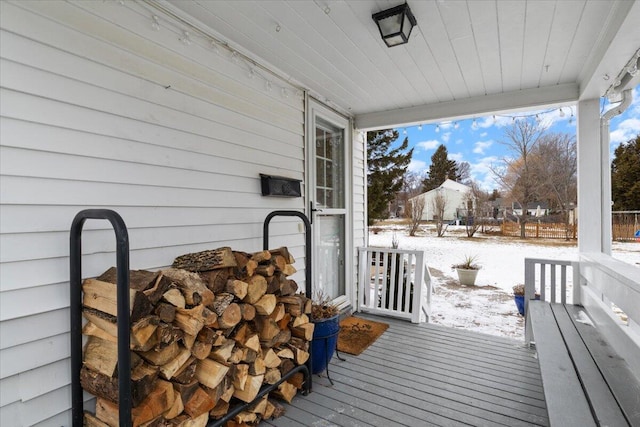 view of snow covered deck