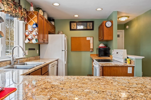 10 Seaside Ave, Saco, ME 04072 - kitchen with white appliances, a sink, brown cabinetry, and recessed lighting